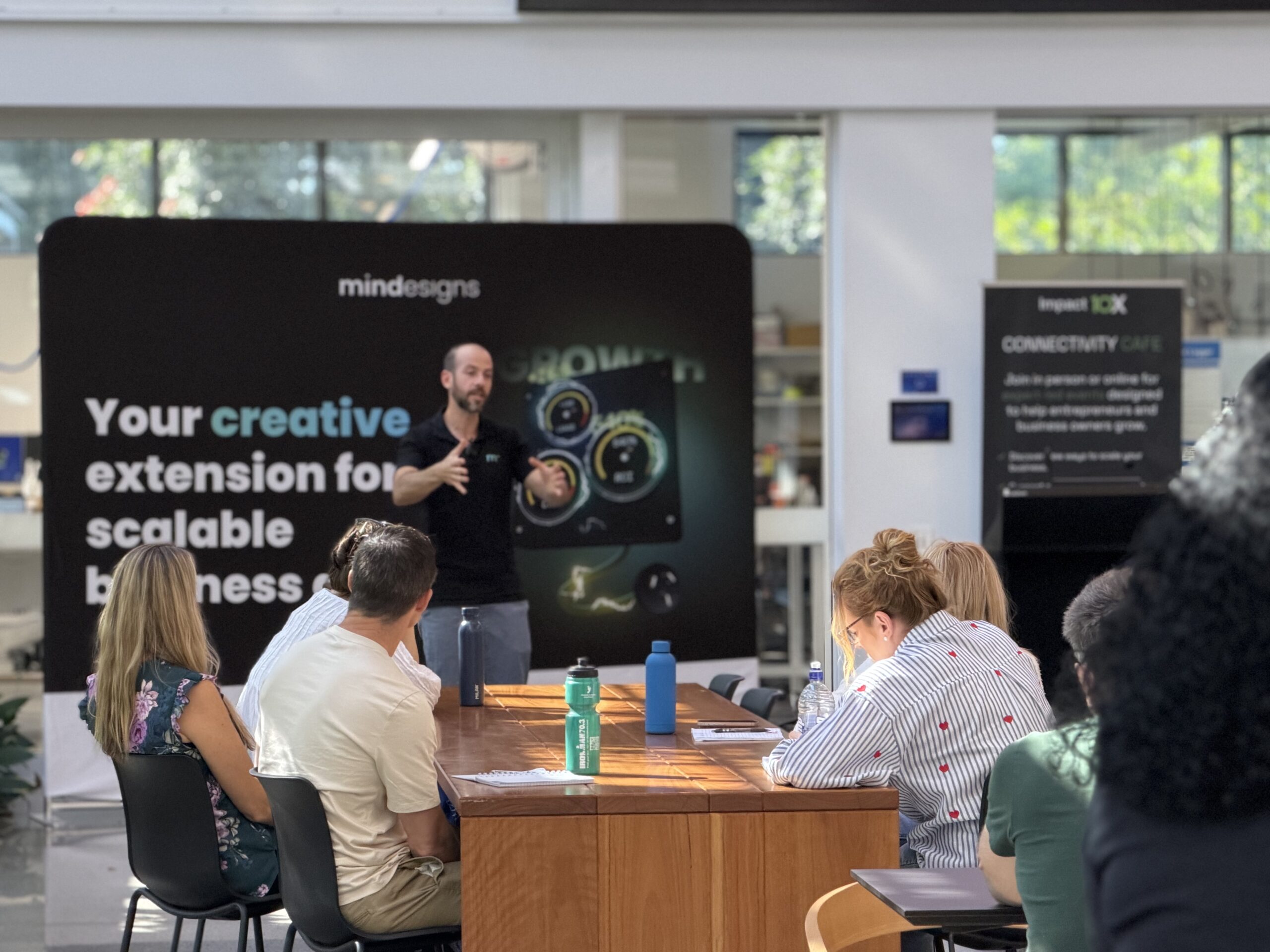 Omer presenting the crossover point sales framework for Impact10X's AI Simulator